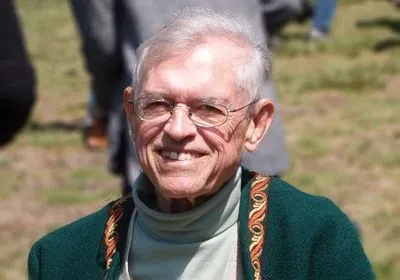 David Wake is facing the camera, smiling.